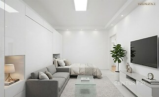 Světlý obývací pokoj s moderní parketovou podlahou, vestavěnými skříněmi a velkými okny, které zajišťují dostatek přirozeného světla.