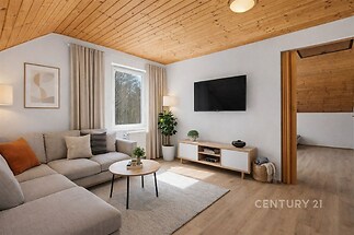 Světlý obývací pokoj s dřevěným stropem, moderními doplňky a parketovou podlahou. Velká okna poskytují přirozené světlo a výhled do přírody.