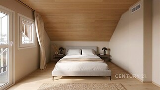 Podkrovní ložnice s dřevěným obložením, velká okna a moderní nábytek, světlý interiér s parketovou podlahou.