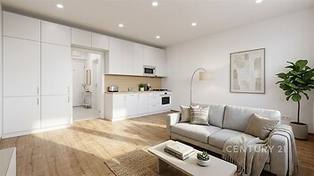 Světlý obývací pokoj s moderní kuchyní, parketová podlaha a vestavěné skříně, elegantně zařízený a rekonstruovaný interiér.