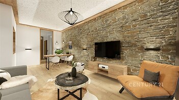 Světlý obývací pokoj s parketovou podlahou, kamennou zdí a moderním osvětlením, nabízí útulnou atmosféru a stylové zařízení.
